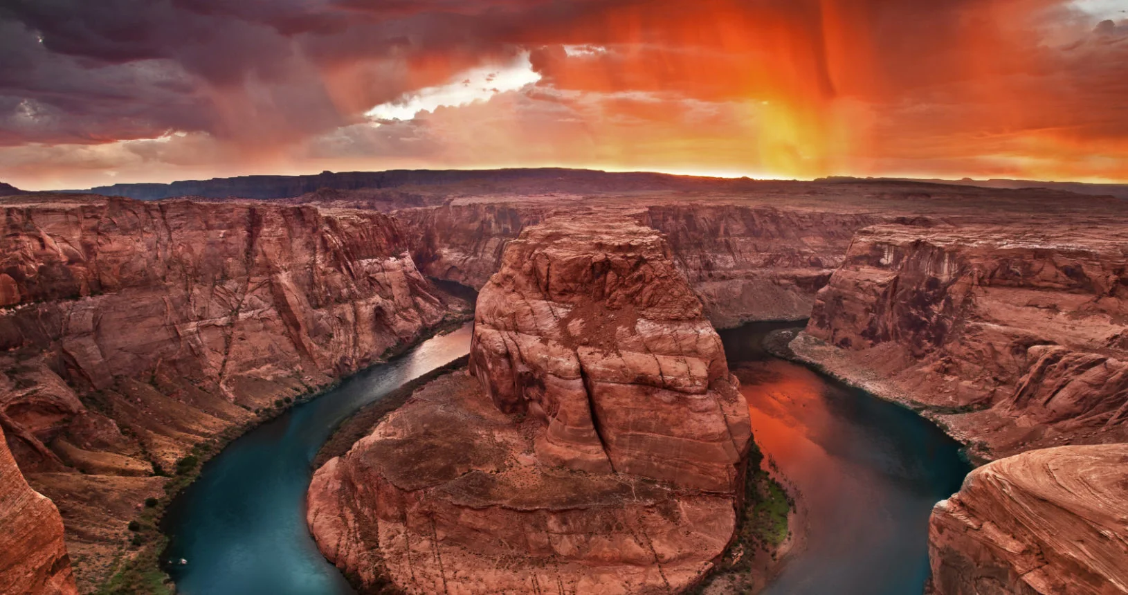 Aerial view of Horseshoe Bend — the Colorado River curving through red rock canyon near Page, Arizona