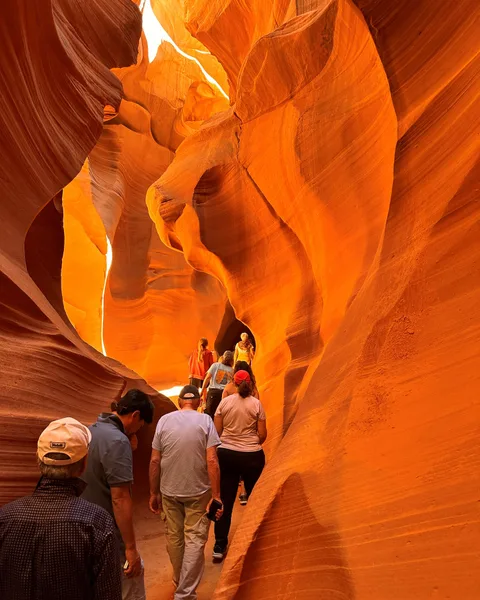 Glowing orange and pink walls inside Antelope Canyon