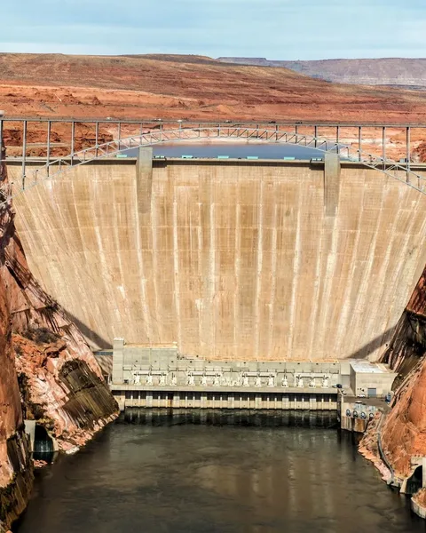 Glen Canyon Dam concrete arch spanning the red canyon walls above the Colorado River